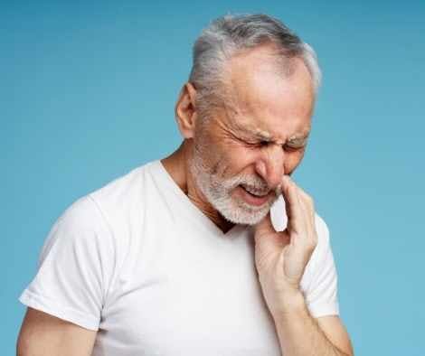 Person experiencing severe, radiating jaw pain